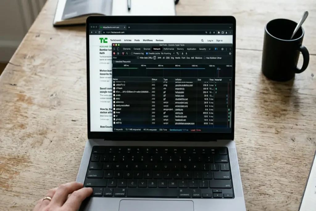stop browser tracking — laptop screen showing browser developer tools network tab with third-party tracker requests listed